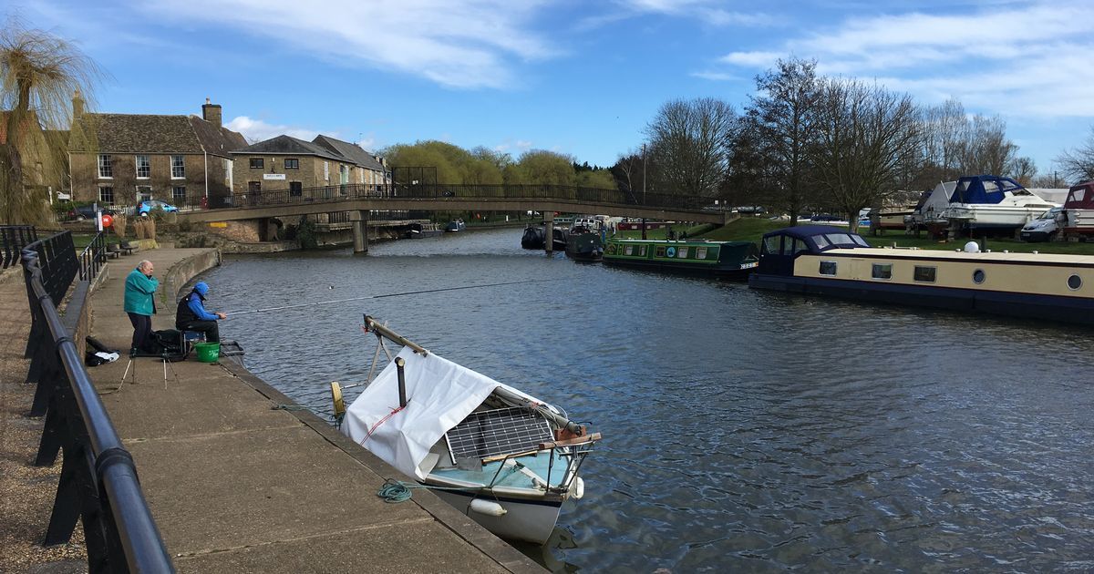 Things to do in East Cambridgeshire - Angling. Image of anglers angling in river with boats and bridge background