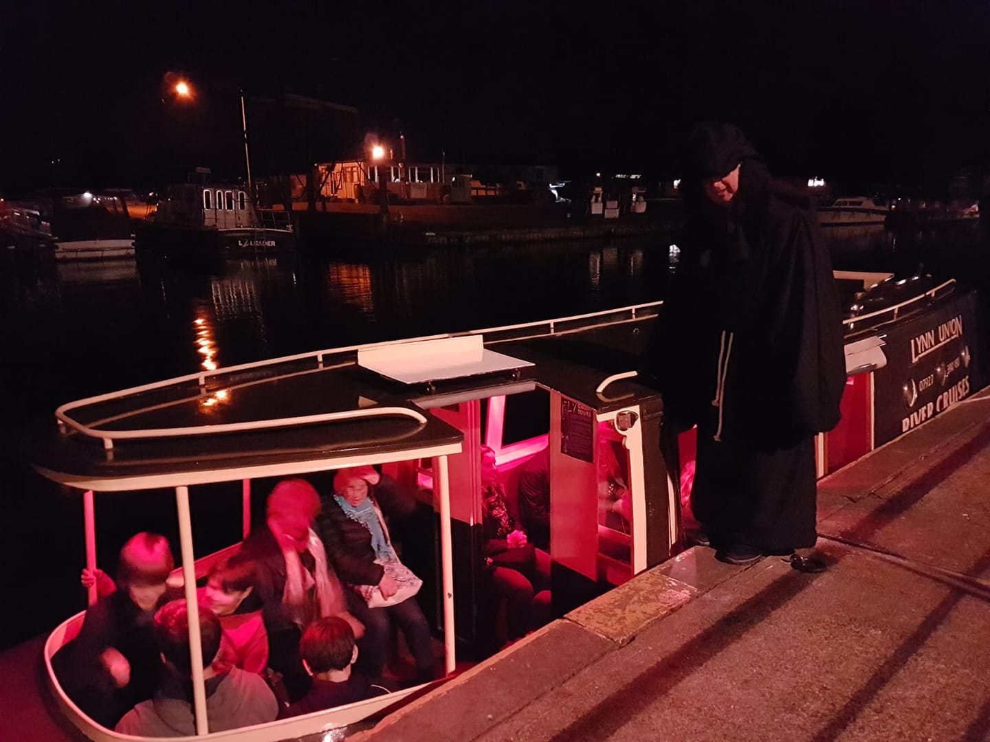 Things to do in East Cambridgeshire - Night time river cruise. River cruise boat with smiling passengers