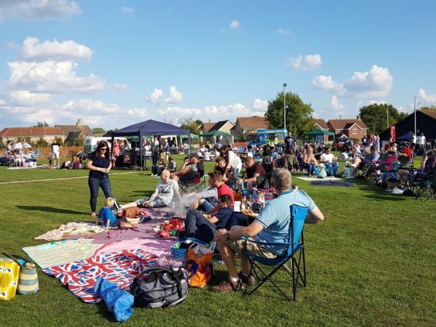 Things to do in East Cambs in Summer - Sutton Picnic. Families picnic-ing in a park